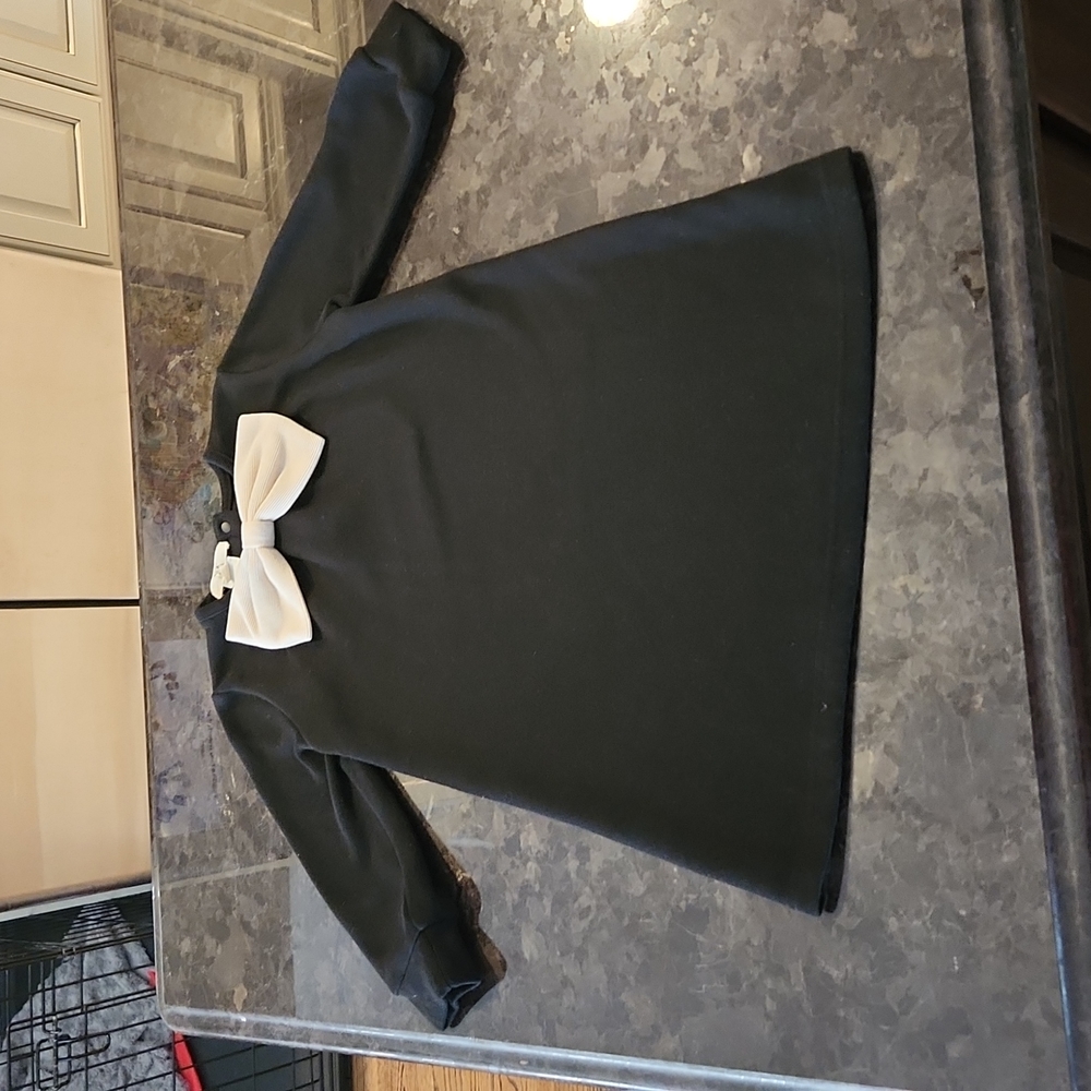 Toddler girl knee length black dress with Cream Bow detail, button up closure